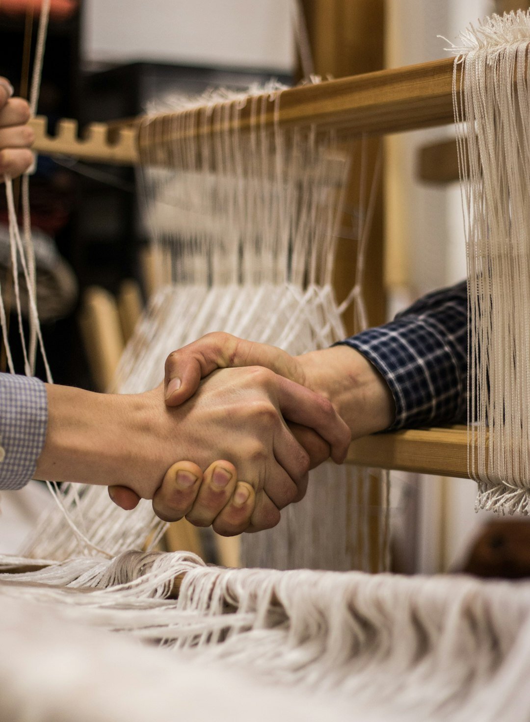 People shaking hands at a business meeting